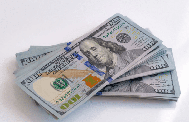 Stack of 100-dollar bills with Benjamin Franklin's portrait.